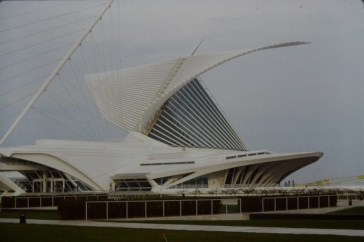 Milwaukee's Art Museum, the white Quadracci Pavilion with its winglike brise soleil raised against an overcast gray sky.